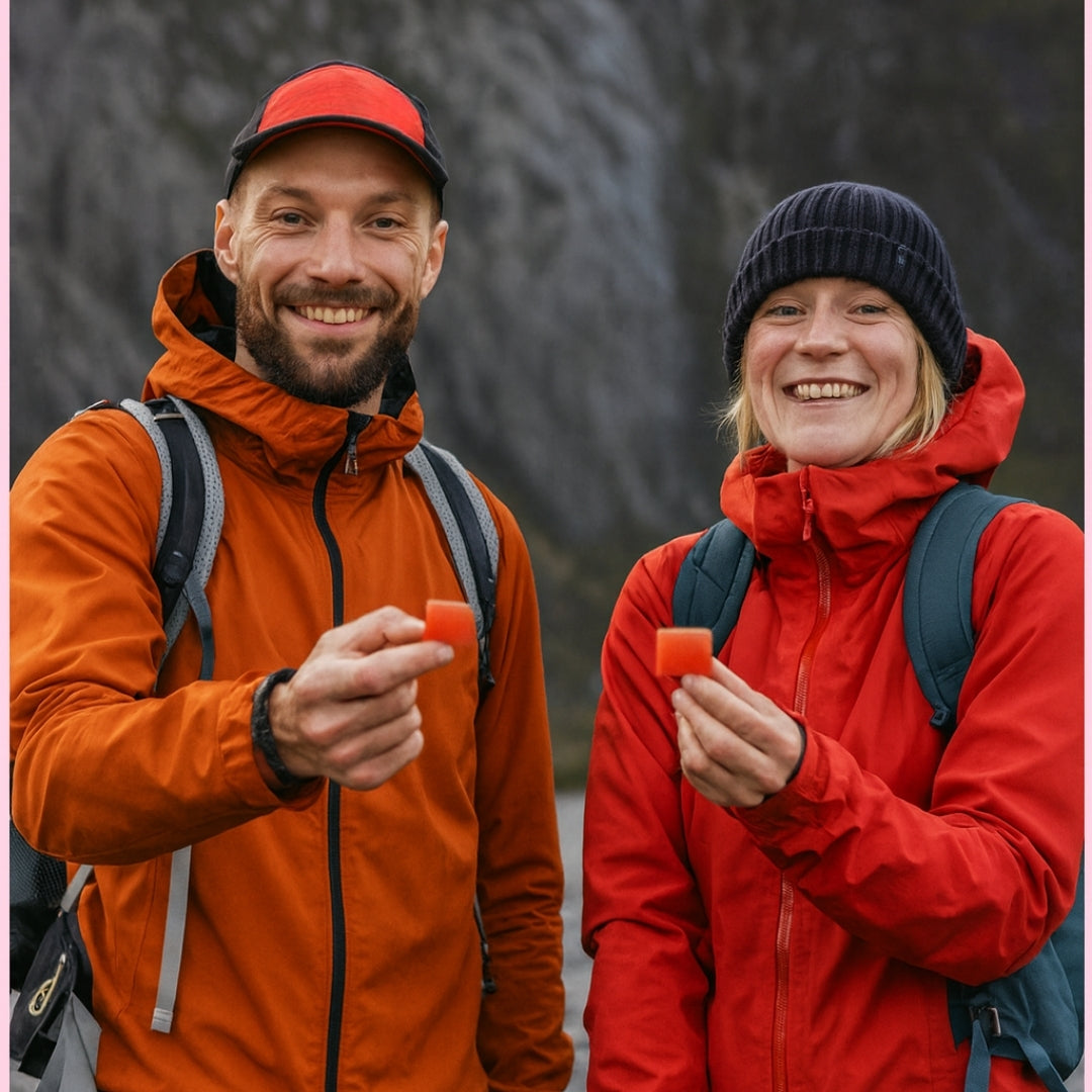 Hikers holding PEAKLOOM strawberry creatine gummies outdoors